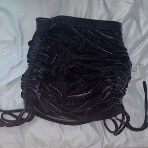 Black ruched velvet skirt.